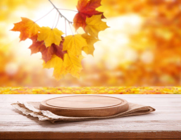 istock Pizza board with tableclothe on wooden desk. Autumn background. Top view mock up. Selective focus. 1164141552