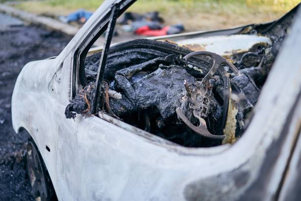 istock Burnt wreck of car 1164143303
