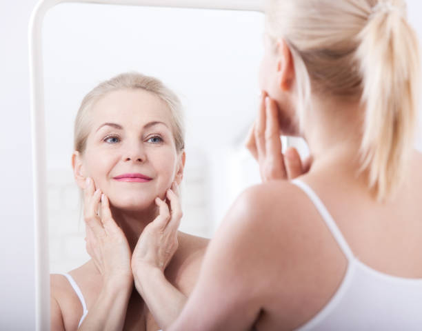 istock Fourty years. Wrinkles on forehead and face. Face plastic. 1164144096