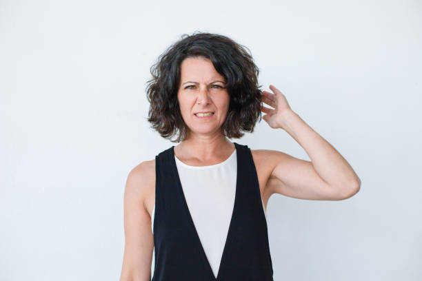 istock Unhappy woman touching hair 1164145029