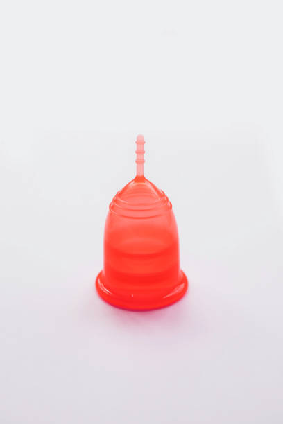 istock Red menstrual cup on a pink background. 1164146504