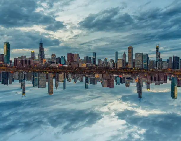 Photo of Scene of Chicago Cityscape river side along Lake Michigan at beautiful twilight time, Illinois, United States, Reflection with opposite concept, Business Architecture and building with tourist concept