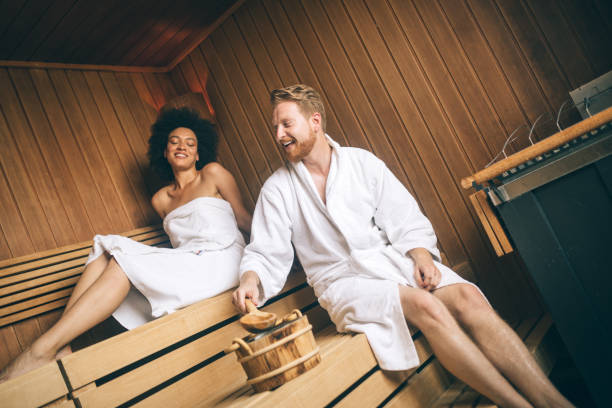 istock Young happy couple relaxing inside a sauna at spa resort hotel luxury 1164149242