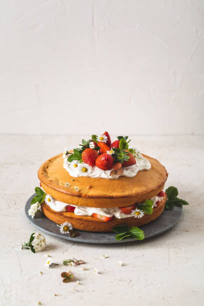 istock Strawberry cake, coconut cream and chamomile. Vegetarian dessert 1164151395