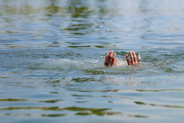 istock Hands with splashes of water drowning man. Copy space. 1164154084