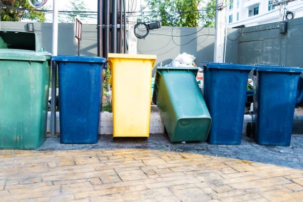 istock Dustbins trashcan rubbish bins outside against brick wall in Thailand 1164156863