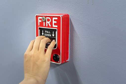 Fire alarm located at wall of building ,activate by hand pulling. Using in case of fire.
