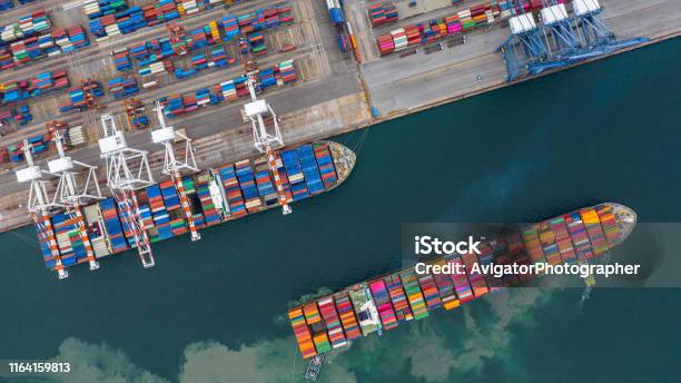 Aerial View Cargo Ship Terminal Unloading Crane Of Cargo Ship Terminal Aerial View Industrial Port With Containers And Container Ship Stock Photo - Download Image Now