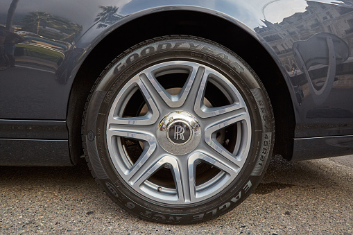 MONTE CARLO, MONACO - AUGUST 19, 2016: Rolls Royce luxury car silver wheel with logo and Goodyear tire in a summer day in Monte Carlo, Monaco.