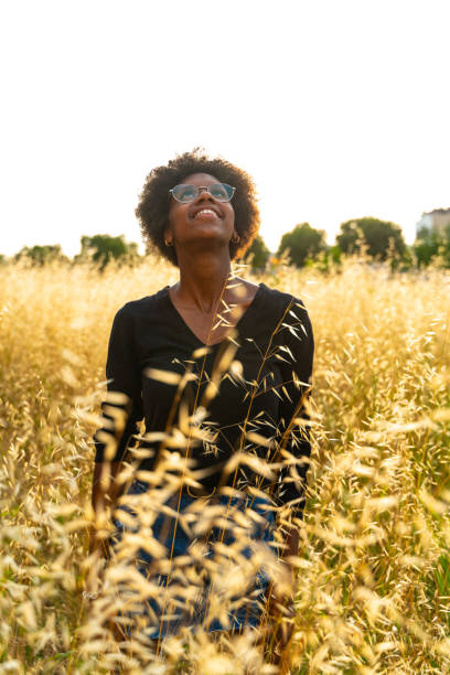 Beautiful young woman enjoying a sunny summer afternoon stock photo