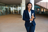 Cheerful businesswoman with digital tablet