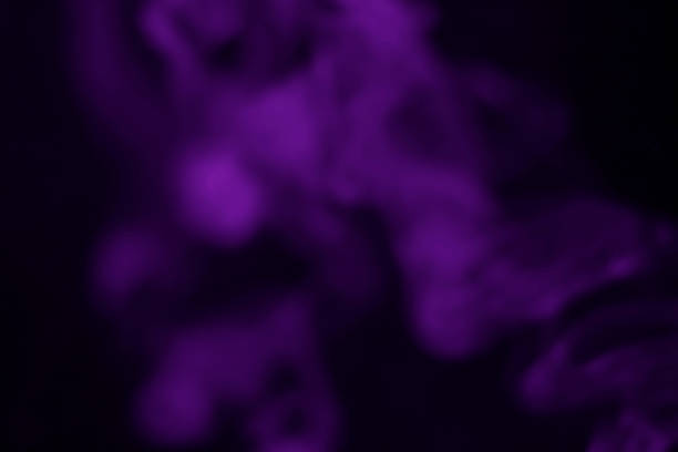 Purple smoke blurred on a black background