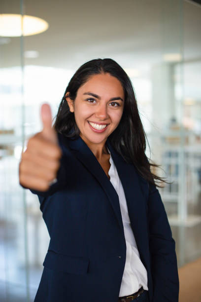 istock Happy young woman showing thumb up 1164165534