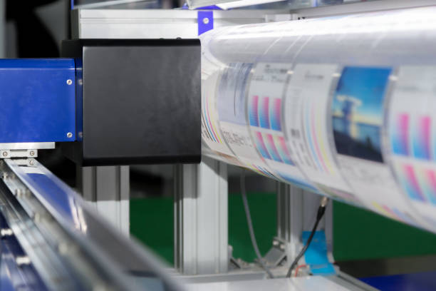 istock new innovative digital technology of automatic printing machine is printing on continuous in the printing factory. 1164165557