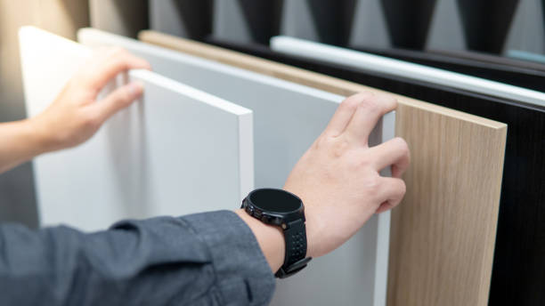 istock Male hand choosing cabinet or countertop materials 1164165895