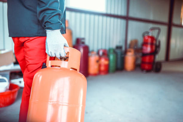istock Gas Cylinder Lined Up To Be Filled In Store 1164166786