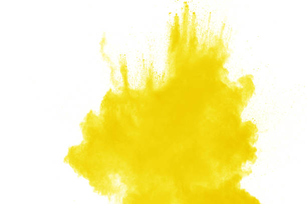 istock Yellow dust particles explosion on white background. Yellow powder dust splash. 1164167125