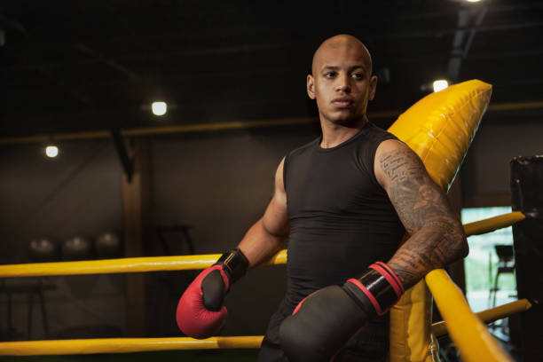 istock Handsome African athletic boxing fighter exercising 1164168839