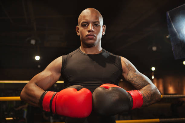 istock Handsome African athletic boxing fighter exercising 1164168913