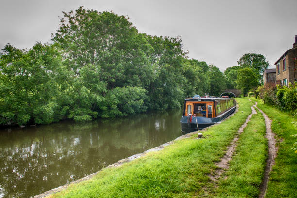 istock Narrowboat on a British canal in rural setting 1164169394