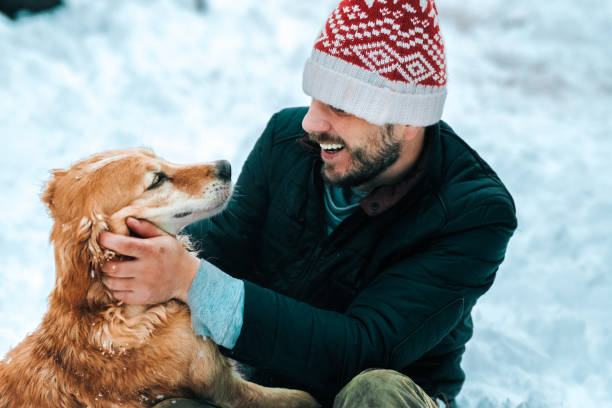 istock Happy man with a golden retriever dog 1164170446