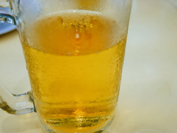 istock Close-up beer cool glass on table. 1164171395