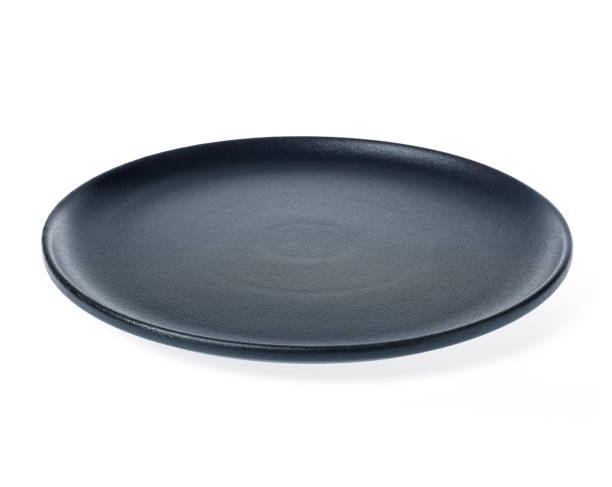 istock Big black ceramic plate isolated on white background. 1164174891