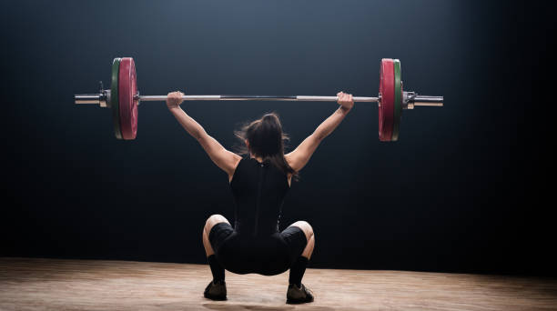 istock Young Woman Performing Deadlift 1164175327