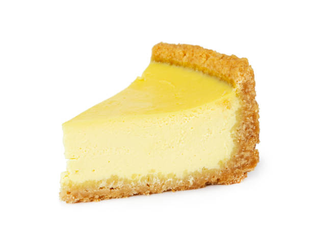 istock Piece of lemon cheesecake isolated on white 1164176924