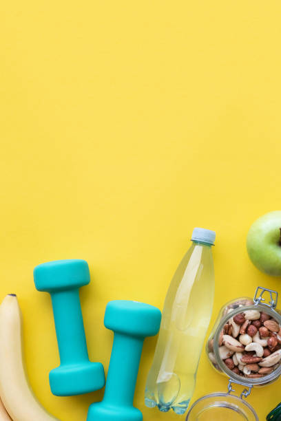 istock Fitness and diet concept on yellow background with copy space 1164177510