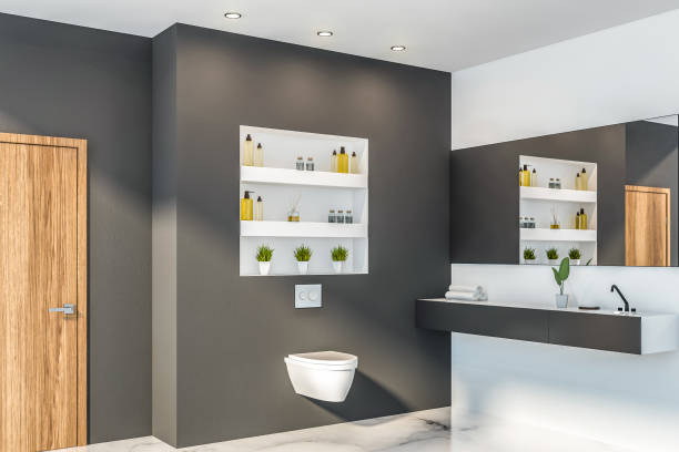 istock Gray bathroom corner, toilet and sink 1164178598