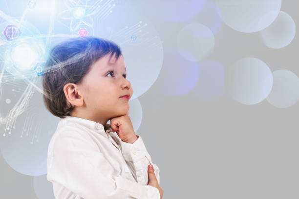 istock Thoughtful little boy, atom hologram 1164179234