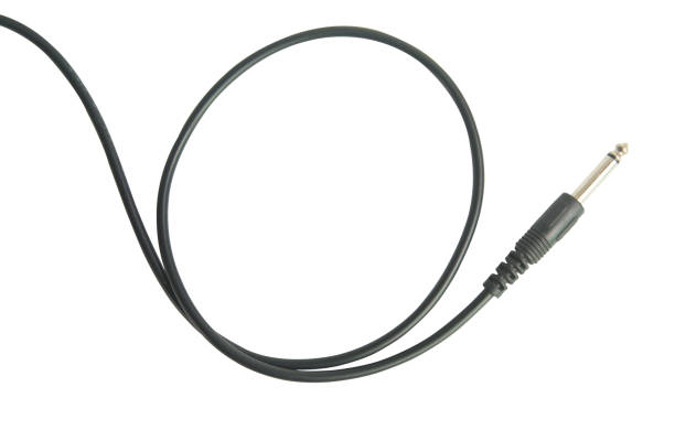 istock Guitar audio jack with black cable isolated on white background with clipping path 1164179780