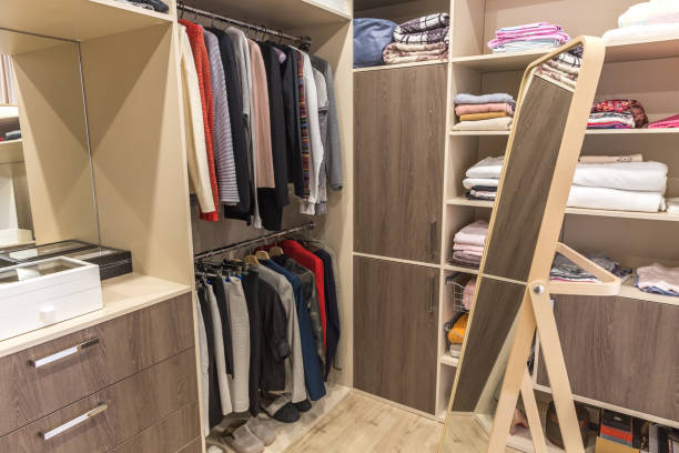 istock Big wardrobe with different clothes for dressing room 1164179880