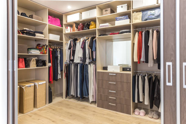 istock Big wardrobe with different clothes for dressing room 1164179942