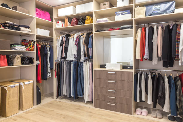 istock Big wardrobe with different clothes for dressing room 1164180494