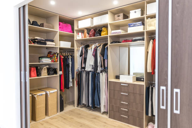 istock Big wardrobe with different clothes for dressing room 1164180598