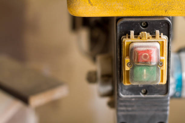 istock Close-up circular saw switch with two green and red buttons, selective focus 1164180723