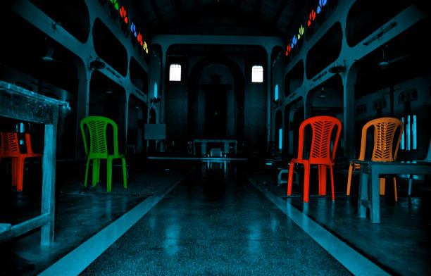 istock Colourful chairs around a Christian Church 1164180871