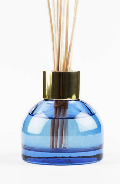 Fragrance Oil Fragrance oil in decorative blue bottle. scent container stock pictures, royalty-free photos & images