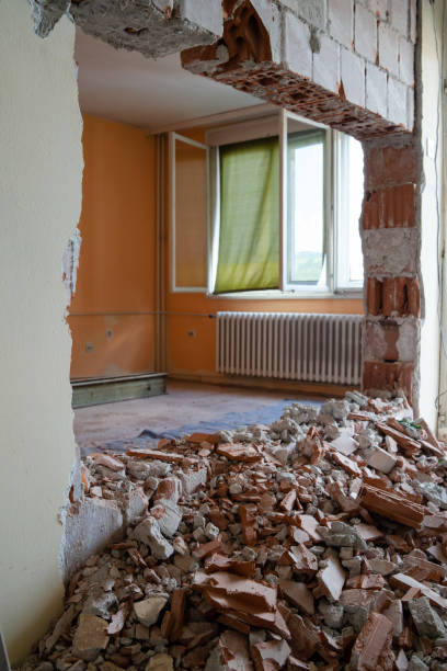 istock Wall smashed into debris room in apartment ready for renovation with destroyed smashed wall demolish 1164183556