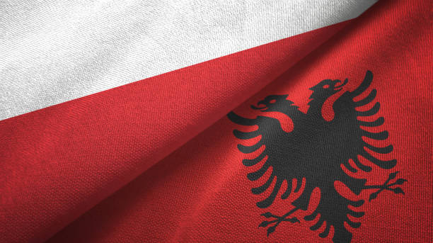istock Poland and Albania two flags textile cloth, fabric texture 1164189550