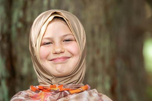 Muslim Caucasian nine years old girl wearing a hijab