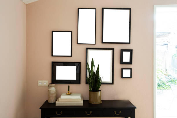 istock collection of various blank black frames on wall with modern decoration, green plant in a lovely home 1164190779