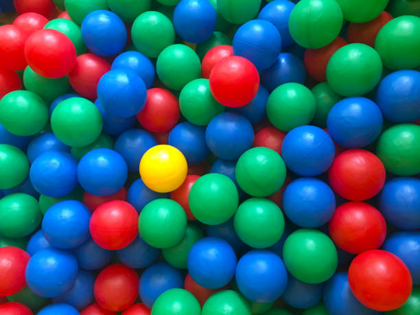 istock Multi-colored plastic balls colorful plastic balls on children's playground red blue yellow  green bright orange plastic small. 1164191123