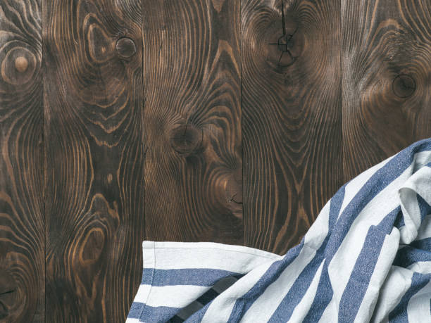 istock linen napkin on wooden table, top view, mock up 1164191696