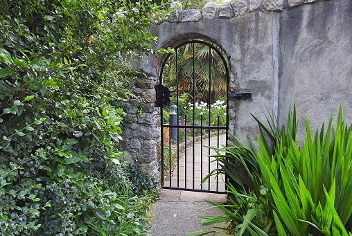 Closed entrance gate into a secret garden.