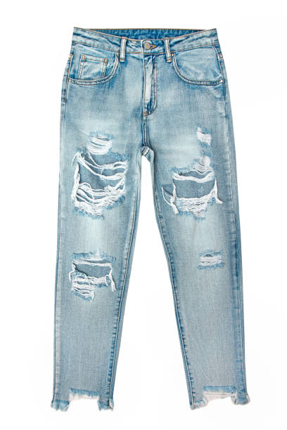 istock Women's blue jeans with holes isolated on white background 1164193781
