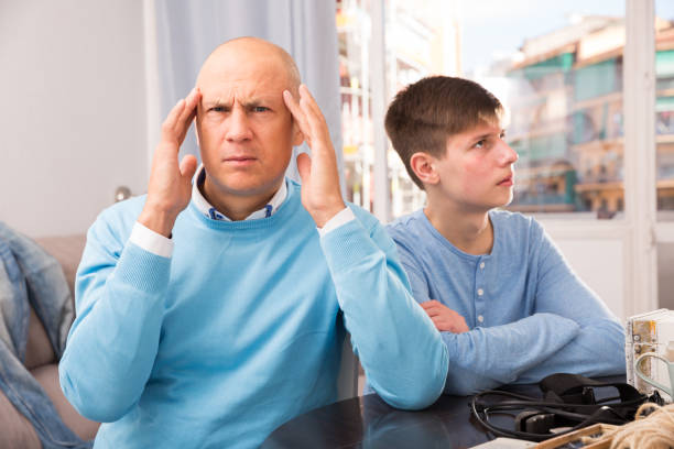 istock Man and his son offended at each other 1164194051