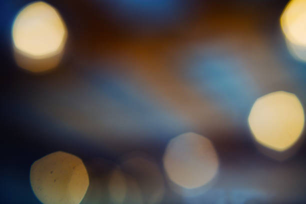 istock Blurred bokeh golden and blue light abstract background. 1164195898